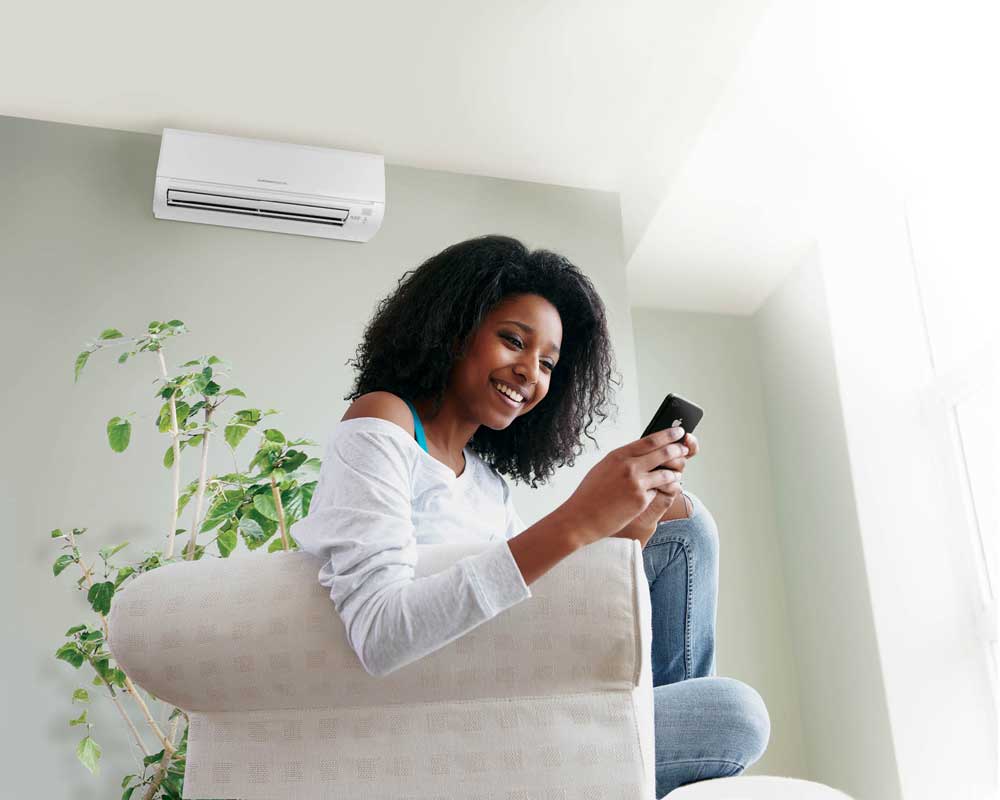 Girl enjoying a comfort of working Ductless Air Conditioners
